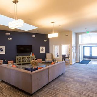 A modern living room with contemporary furniture and elegant lighting.