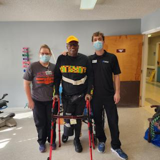 A moment of progress in rehabilitation, showcasing dedication and support.