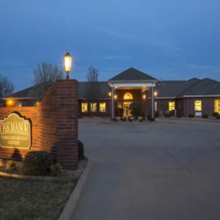 A well-lit building with brick exterior and a welcoming entrance at dusk.