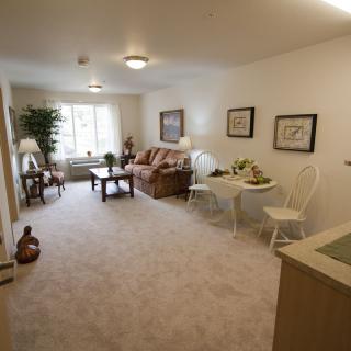 A cozy living room with comfortable furniture and soft lighting.