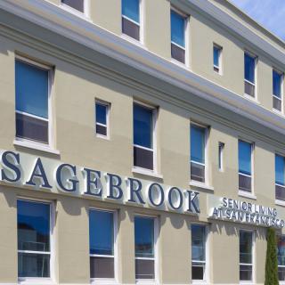 Exterior view of the Sagebrook building with prominent signage and multiple windows.