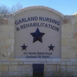 Entrance sign for Garland Nursing & Rehabilitation located in Garland, Texas.