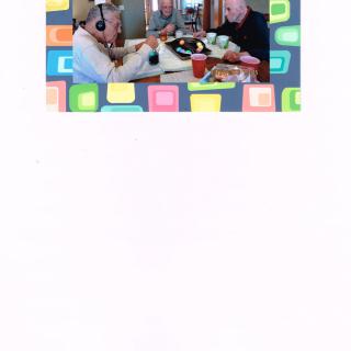 People dining and conversing at a restaurant table.