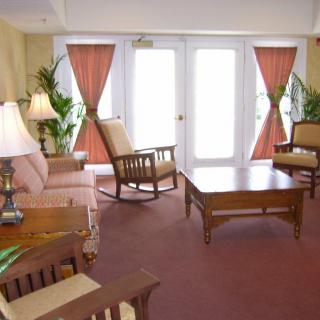 A cozy living room with comfortable seating and natural light.
