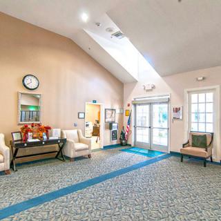 A bright, welcoming lobby with comfortable seating and a skylight.