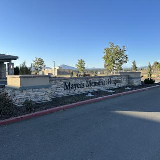 Entrance to Myrtles Memorial Hospital with a clear sky in the background.
