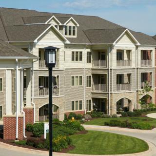 Residential apartment complex with well-maintained landscaping.