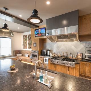 A modern kitchen with sleek appliances and a spacious countertop.