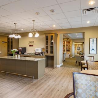 A modern kitchen and dining area with contemporary furnishings and lighting.