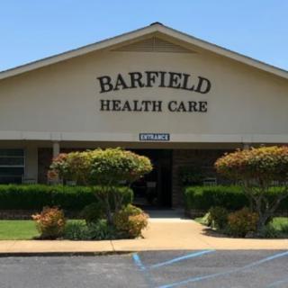 Front view of Barfield Health Care building with landscaped surroundings.