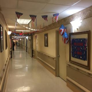 A decorated hallway with festive banners and dim lighting.