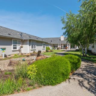 A serene courtyard with well-maintained landscaping on a sunny day.