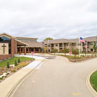 A welcoming entrance to a healthcare facility with well-maintained landscaping.
