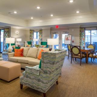 Spacious and elegantly designed living room with comfortable seating and a dining area.