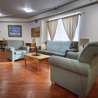 A cozy living room with comfortable seating and warm decor.