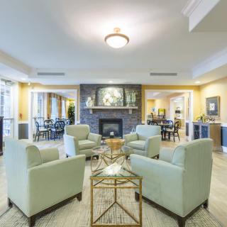 A modern living room with a fireplace and comfortable seating area.