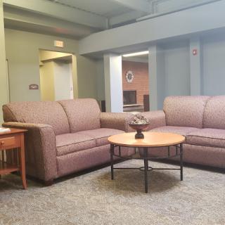 A comfortable seating area featuring two sofas and a coffee table in a modern living room setting.