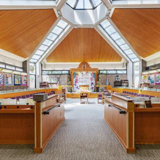 A beautifully designed sanctuary featuring wooden interiors and ample natural light.