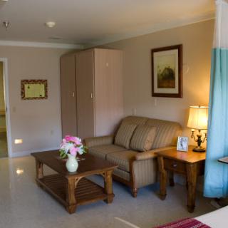 A cozy living room featuring a comfortable sofa, a stylish coffee table, and tasteful decor.