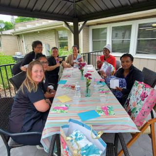 A joyful gathering of friends enjoying a lovely day outdoors.