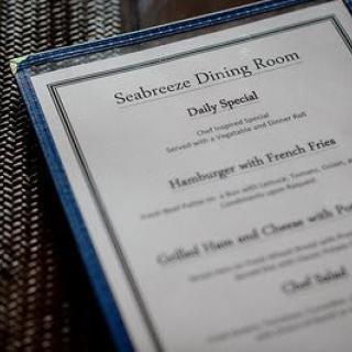 A close-up of a restaurant menu displaying daily specials.
