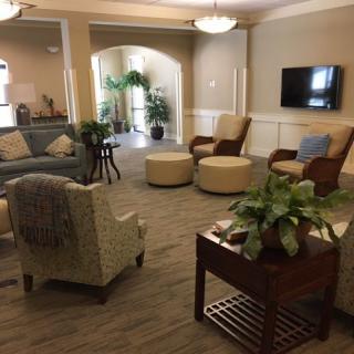 A cozy living room with comfortable seating and a television.