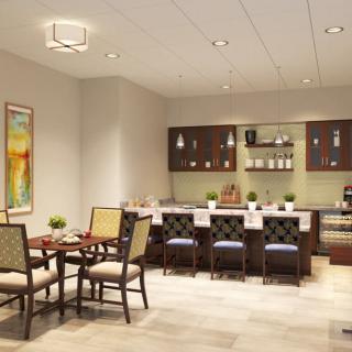 Modern kitchen and dining area with stylish furniture and contemporary lighting.