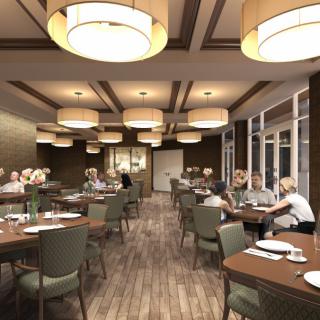 A spacious dining area with neatly arranged tables and warm lighting.