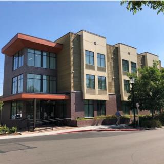 A modern commercial building with large windows and a contemporary design.