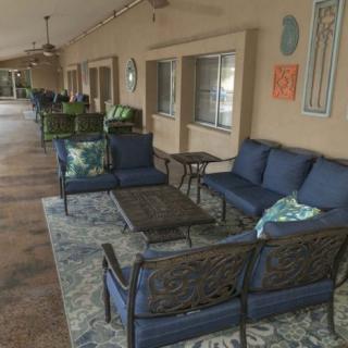 An inviting patio area with comfortable outdoor seating and decor.