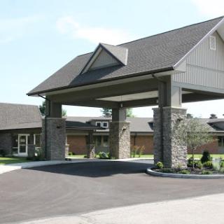 A modern entrance to a residential building, showcasing a welcoming architectural design.