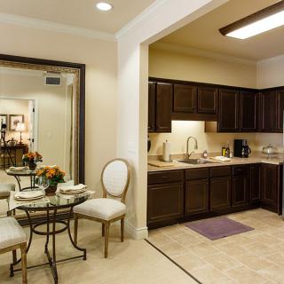 A modern kitchen and dining area with elegant furnishings.