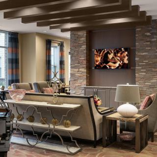 A modern and luxurious living room with elegant furniture and a cozy ambiance.