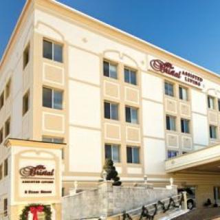 Exterior view of a hotel building with signage.