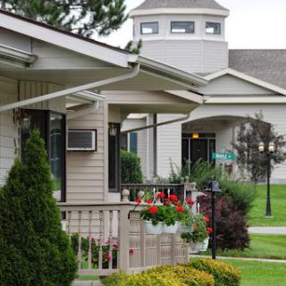 A peaceful residential area featuring well-maintained gardens and inviting architecture.
