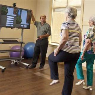 Seniors participating in a fitness class focused on balance exercises.