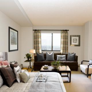 A cozy and elegantly designed living space featuring a comfortable sofa and stylish decor.