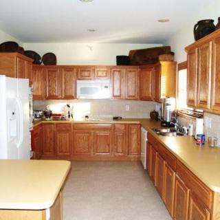 A well-organized kitchen with wooden cabinets and modern appliances.