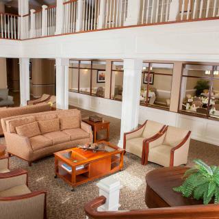 A spacious lobby with comfortable seating and elegant interior design.