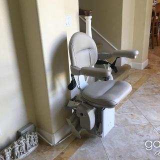 A stair lift installed in a home to assist with mobility.