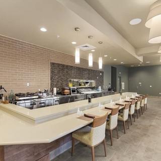 Modern restaurant interior with a sleek bar and comfortable seating.