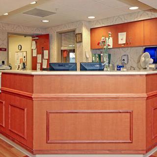 A hospital reception desk with medical supplies and equipment.