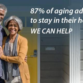 Elderly couple standing in front of their home, highlighting a service that helps aging adults stay in their homes.