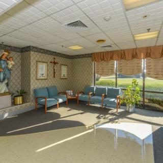 A serene waiting area in a hospital, featuring comfortable seating and ample natural light.