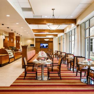 Modern restaurant interior with a neatly arranged dining area.