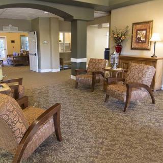 A well-furnished lobby with comfortable seating and elegant decor.