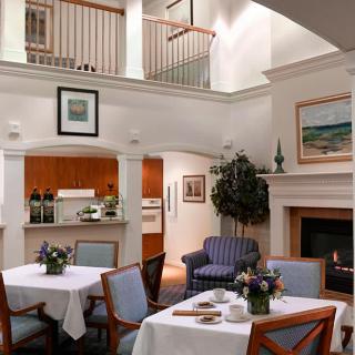 Cozy interior with a dining area, fireplace, and seating.
