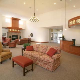 A spacious hotel lobby with cozy seating and elegant lighting.