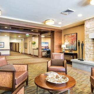 A modern lobby area featuring comfortable seating and stylish decor.