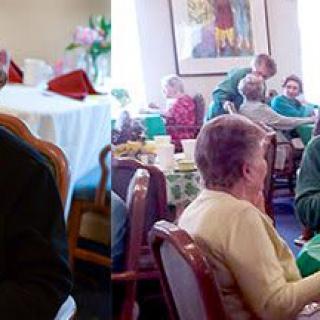 A group of elderly individuals socializing and dining together in a communal setting.